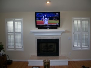 50" TV Installation with Sound bar speaker system above fireplace