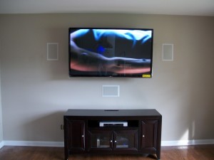 Port City AV Custom installation of 60" LG flat screen and in wall surround sound system.